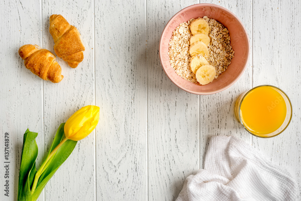 healthy breakfast with porridge on wooden background top view