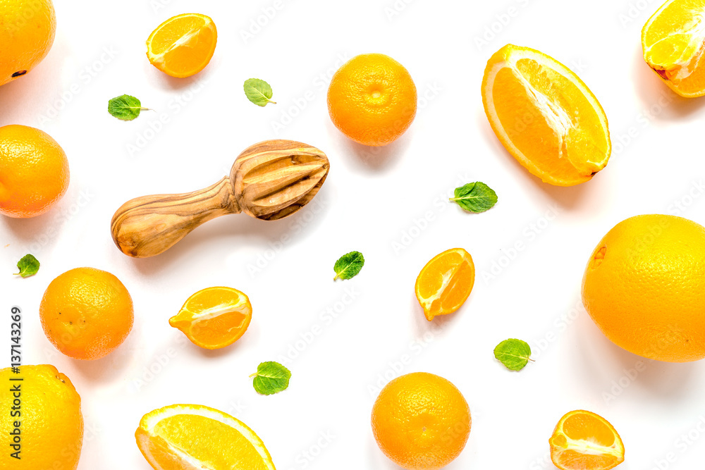 Cut oranges for juicy breakfast on white background top view pattern