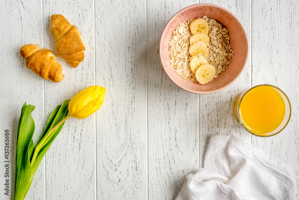 healthy breakfast with porridge on wooden background top view