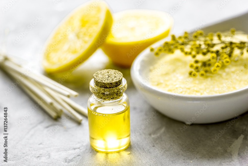 Natural cosmetic with bath salt and organic oil on gray background