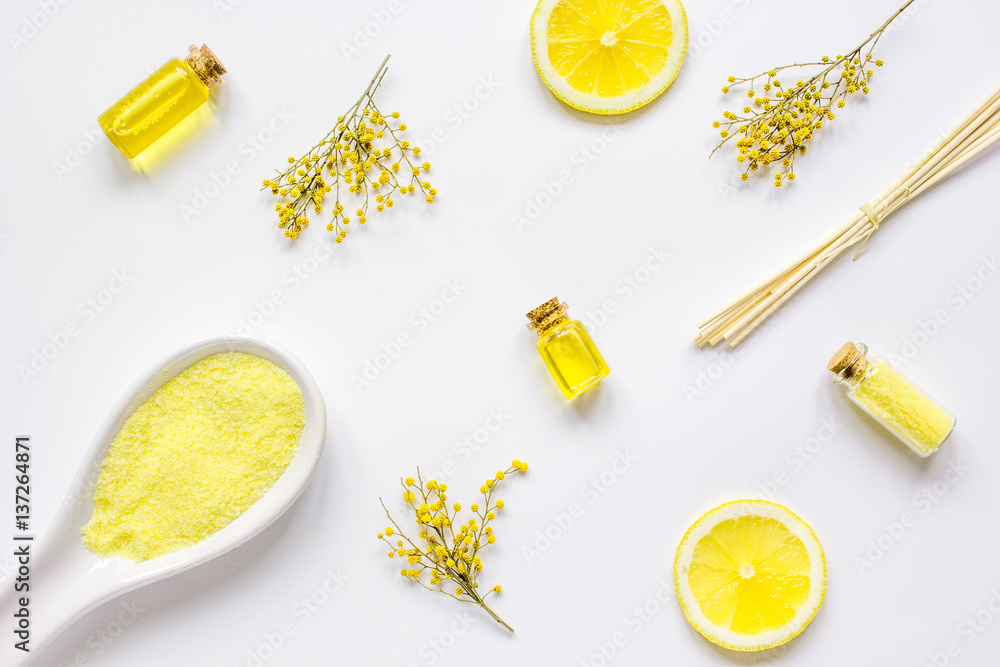 Spa cosmetic with essential oil and salt on white background top view