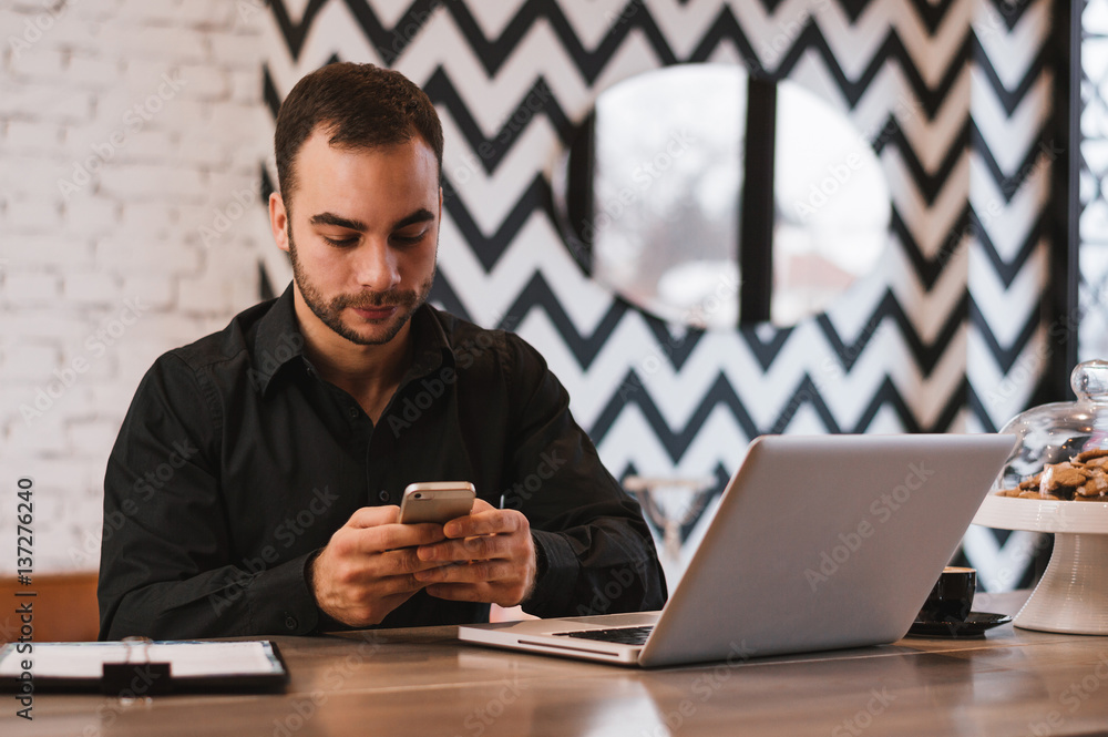 Handsome man checking emails