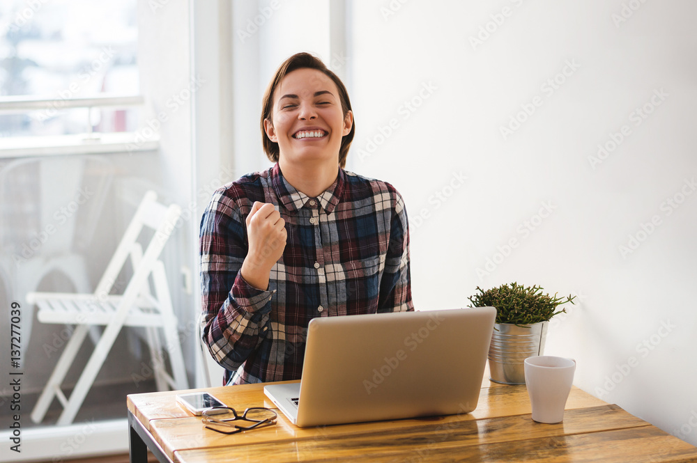 Excited casual entrepreneur girl reading good news