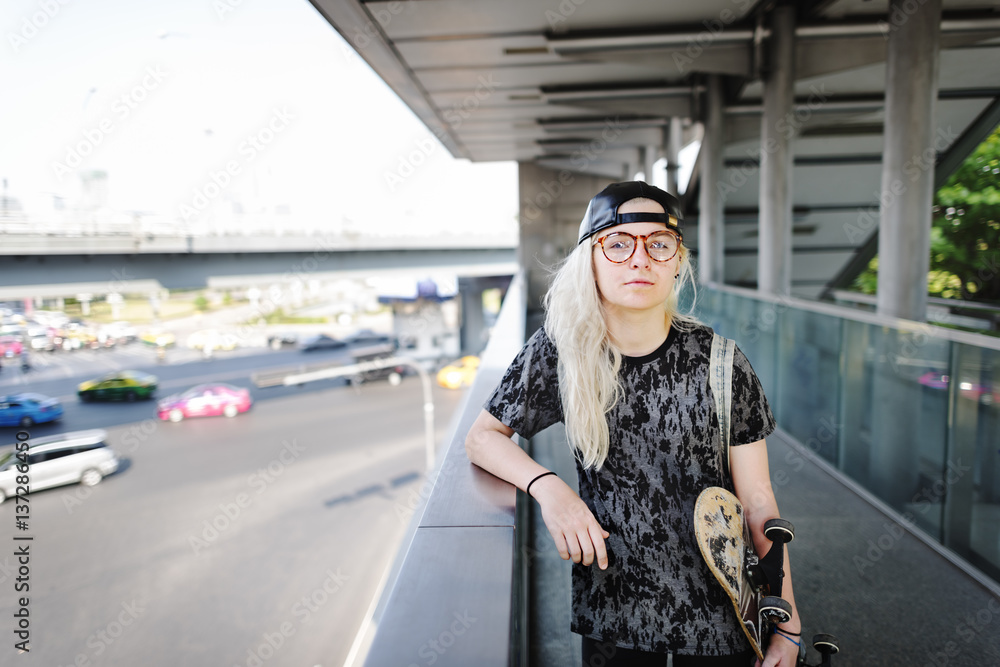 Young Woman Skateboard Standing Outdoors Bridge Concept