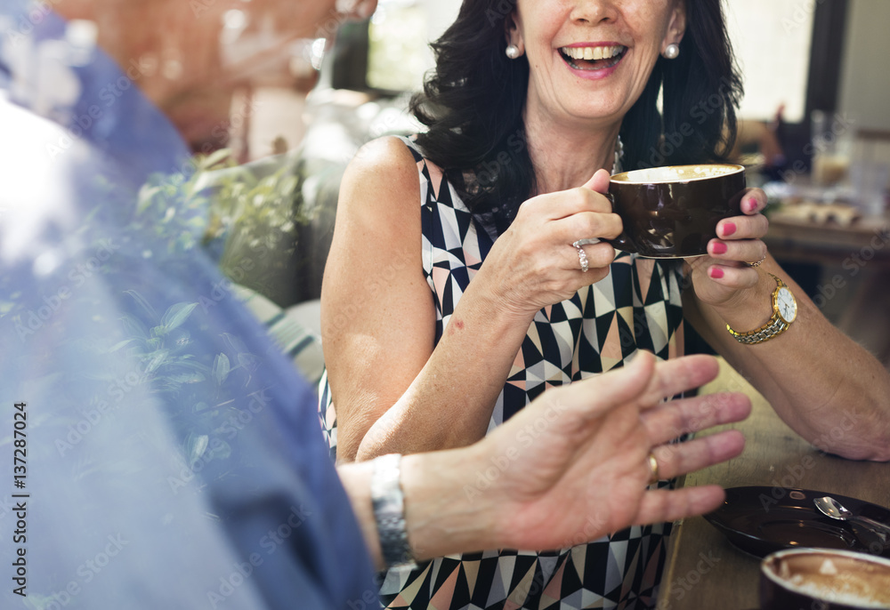 Mature couple drinking coffee together