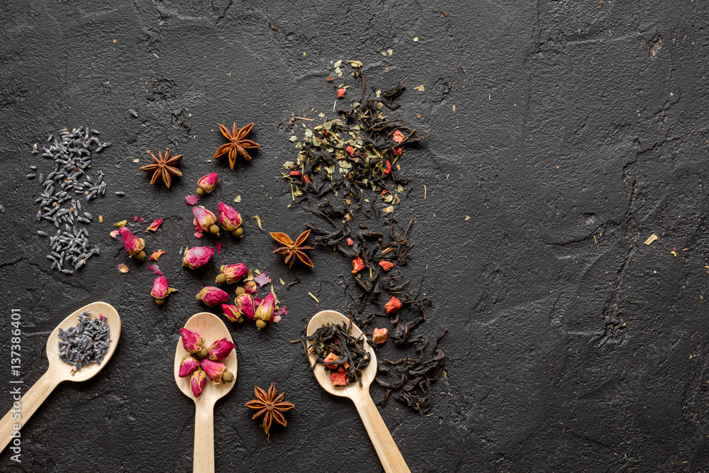 Herbs on spoons black background mockup top view