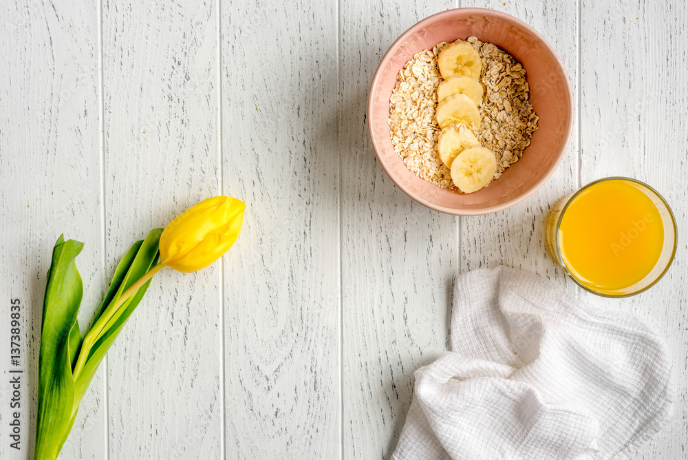 healthy breakfast with porridge on wooden background top view