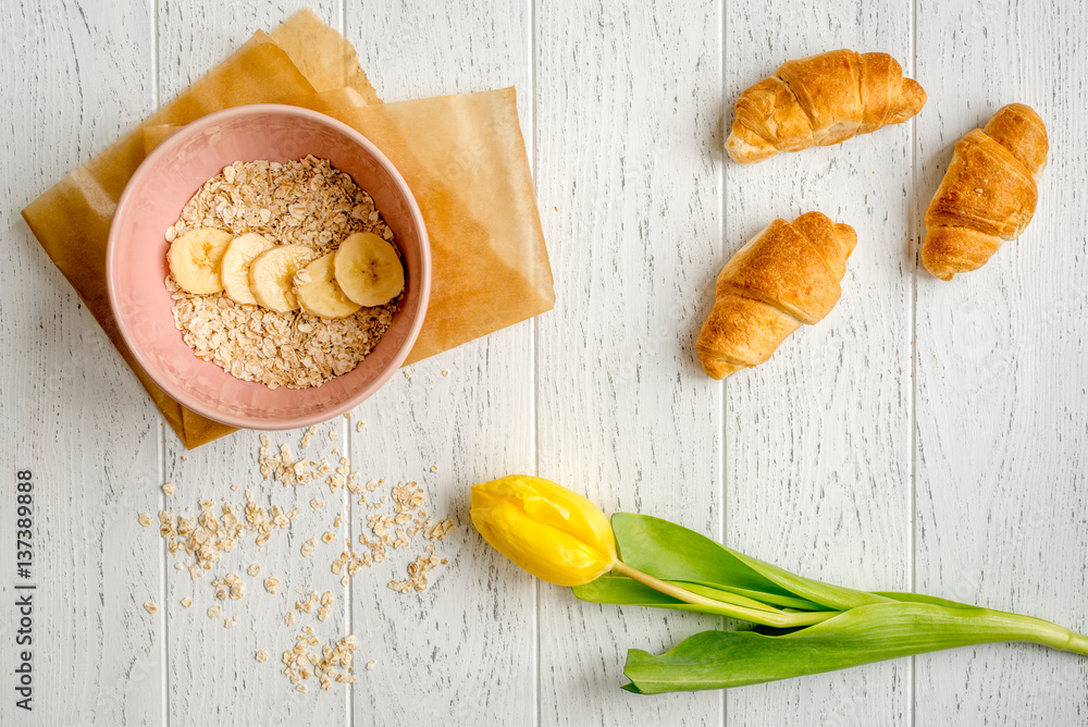 healthy breakfast with porridge on wooden background top view