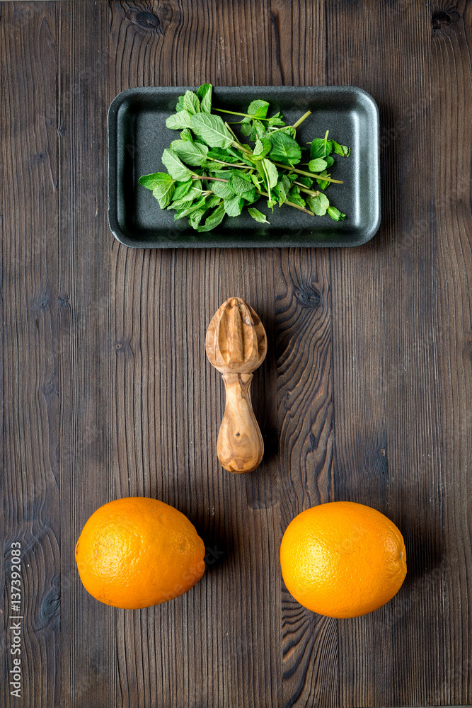 Tasty oranges for cooking smoothie on dark background top view mockup