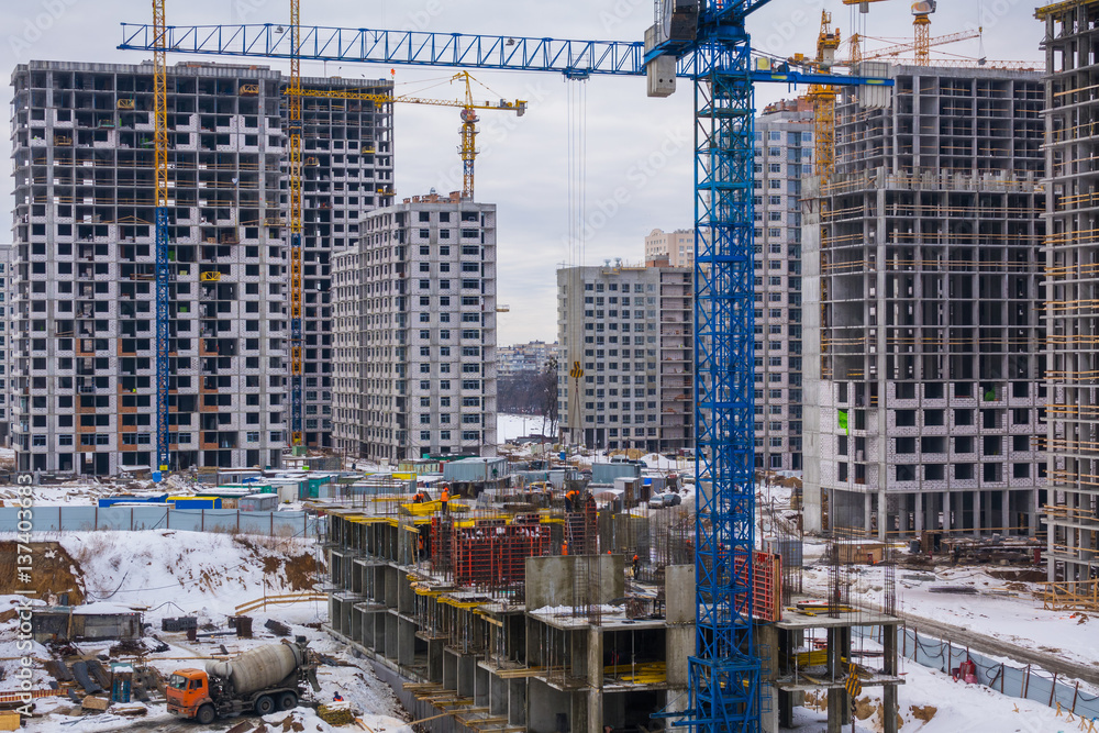 A large construction site with a lot of houses under construction