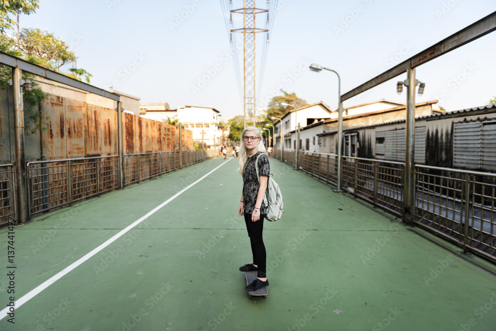 Young Woman Skateboard Standing Outdoors Bridge Concept