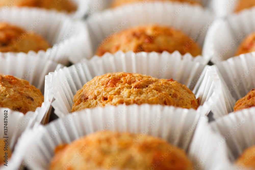  Homemade cheese muffins in paper cupcake cases. Shallow focus. close-up