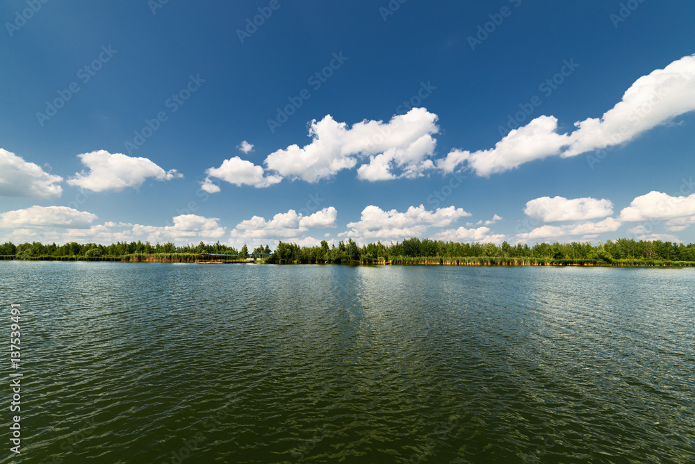 Clean lake and beautiful blue sky with clouds