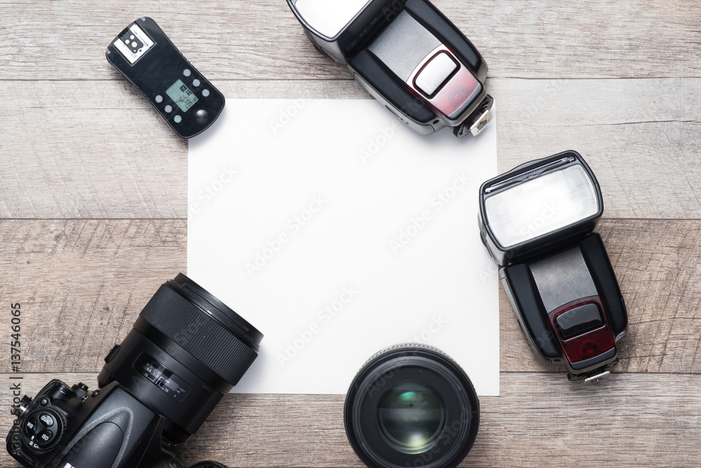 Photographers equipment on the floor in a room with copy space.