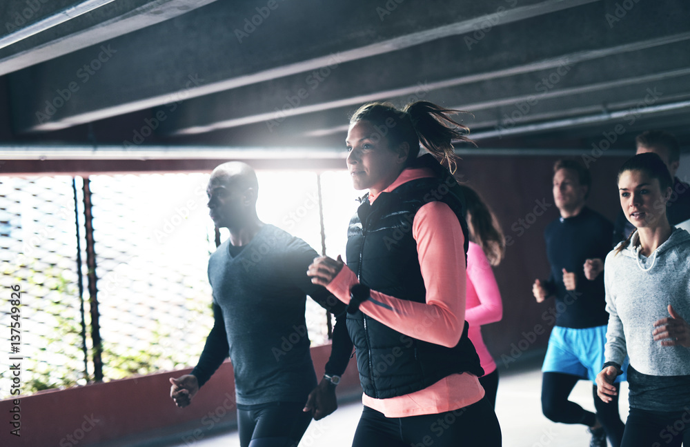 Multiracial young friends enjoying an urban run