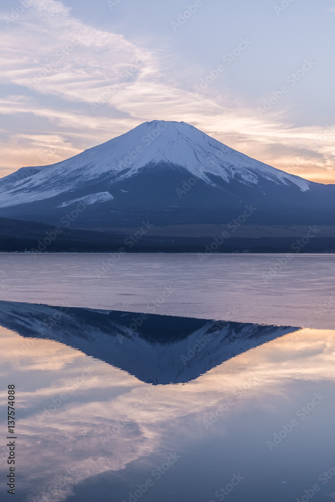 Mountain Fuji and Yamanakako ice lake with reflection in evening winter