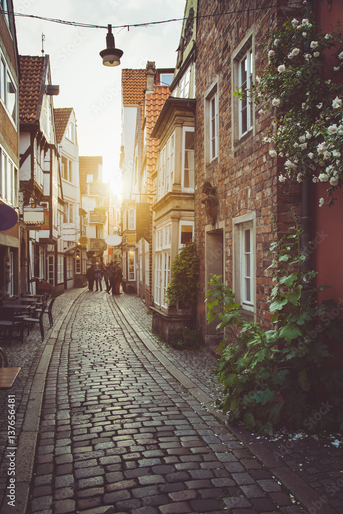 Old town in Europe at sunset with retro vintage filter effect