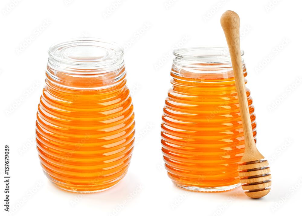 Honey in glass jar isolated on white background