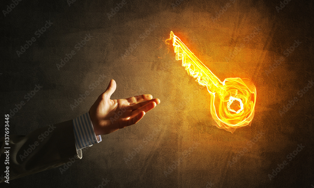 Concept of partnership and cooperation presented by fire glowing key icon