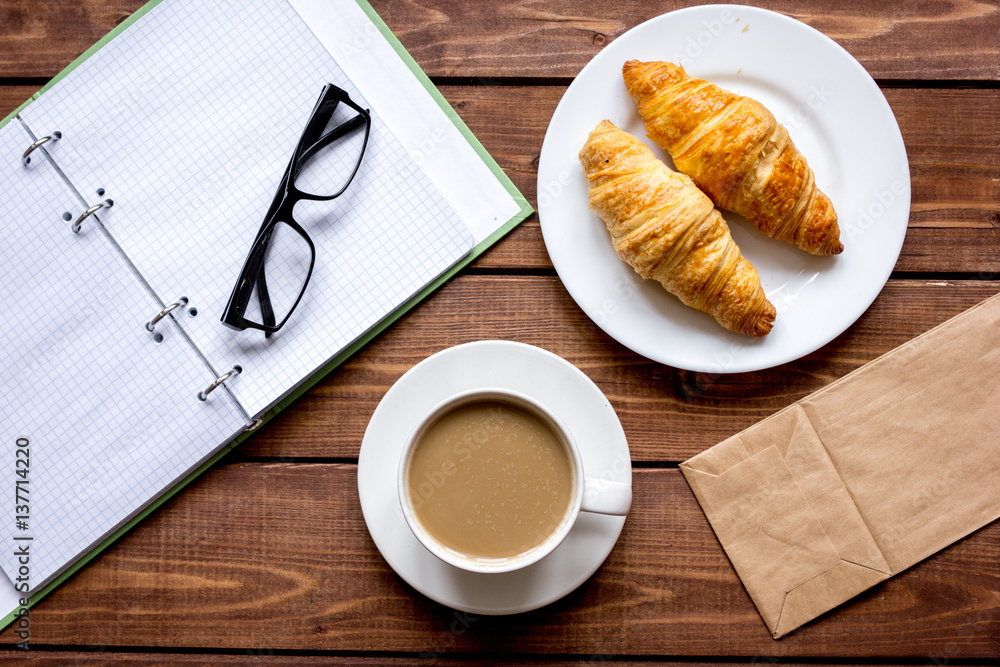 Business breakfast with coffee and croussant top view