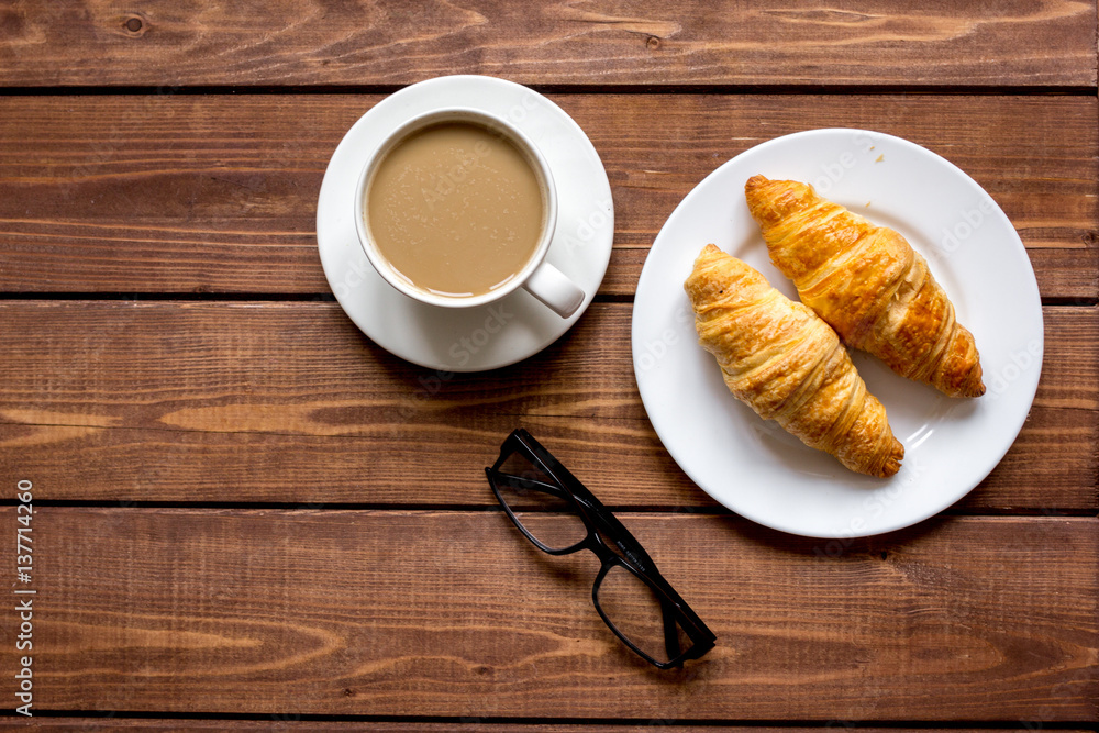 Business breakfast with coffee and croussant top view