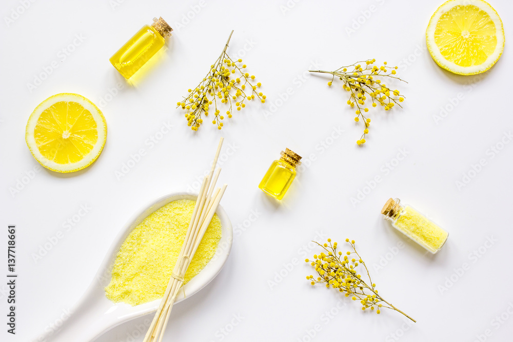 Spa cosmetic with essential oil and salt on white background top view