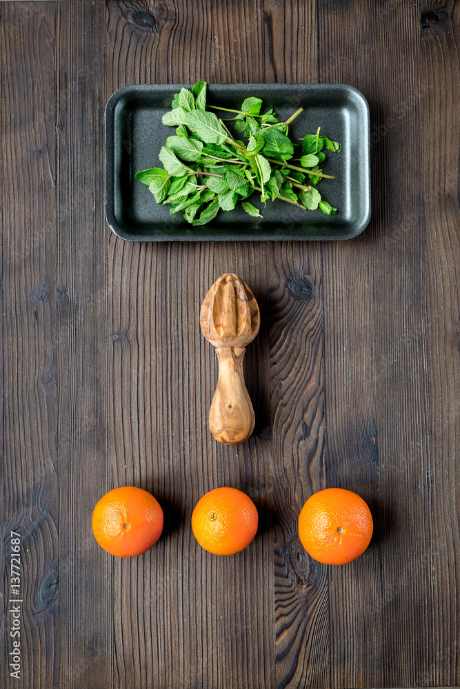 Tasty oranges for cooking smoothie on dark background top view mockup