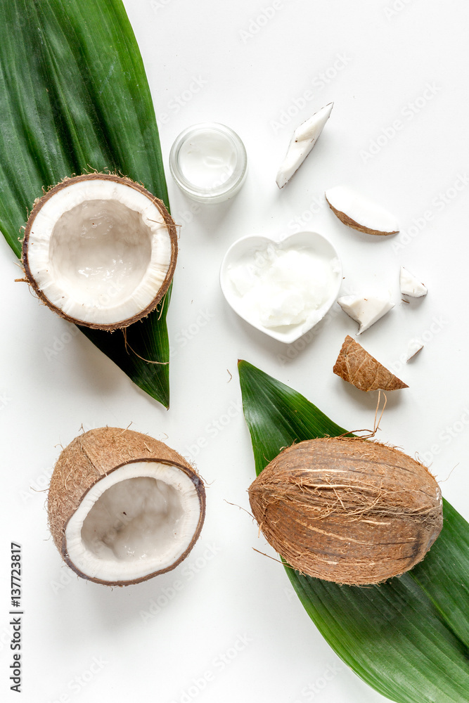 organic cosmetics with coconut on white background top view