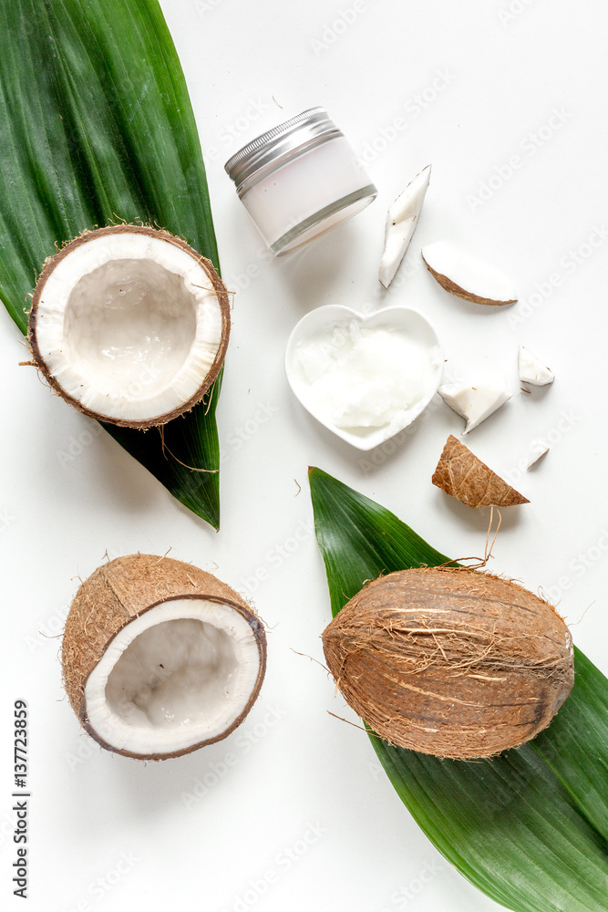 organic cosmetics with coconut on white background top view