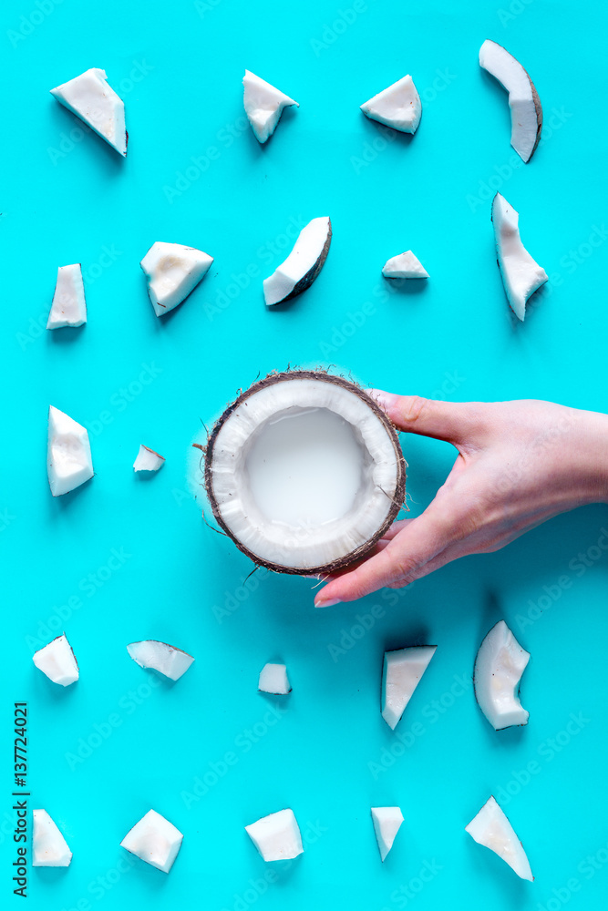 concept organic cosmetics with coconut on blue background top view