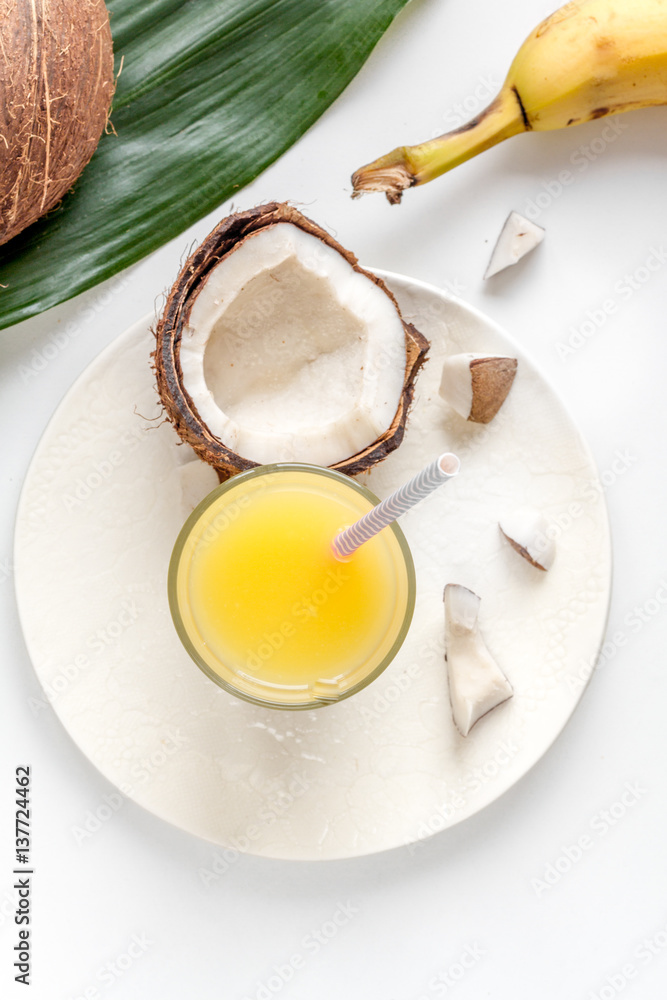 cocktail with coconut on white background top view