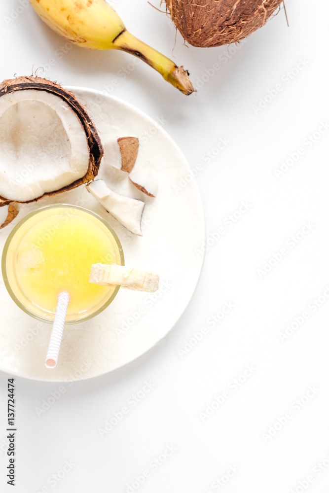 cocktail with coconut on white background top view