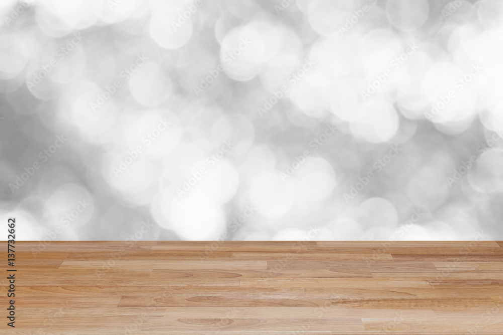 Wood table floor on blur abstract white and bokeh background.