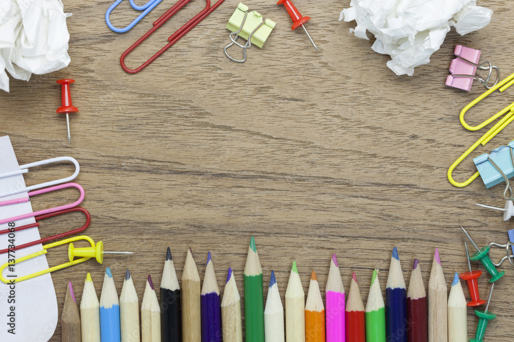 Top view of School and office supplies stationery on wood background,back to school concept.