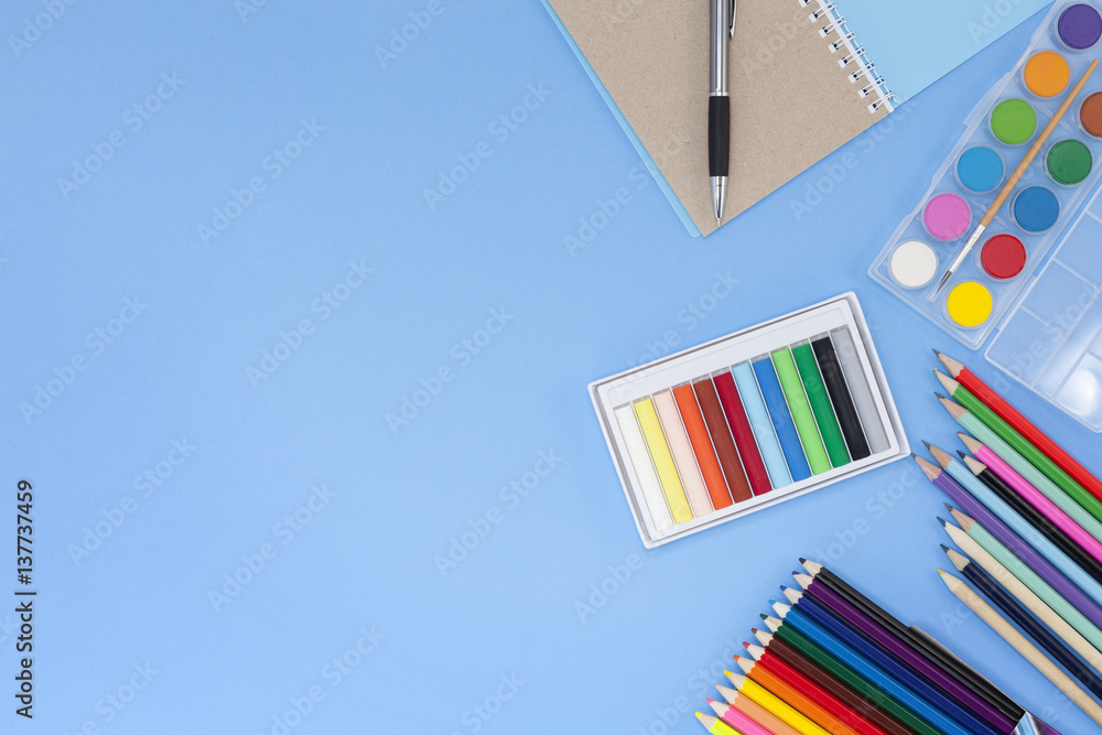 School supplies on blue background,back to school concept.