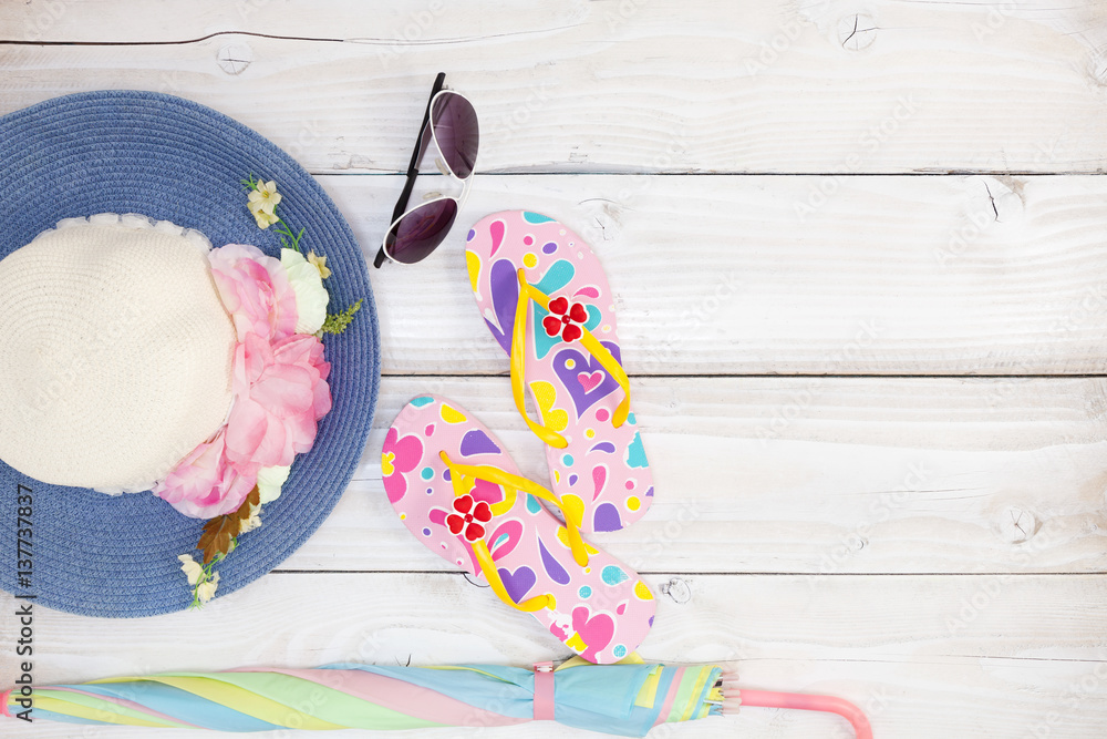 beach shoes with sunglasses and hat on white wood background,Summer holiday concept.