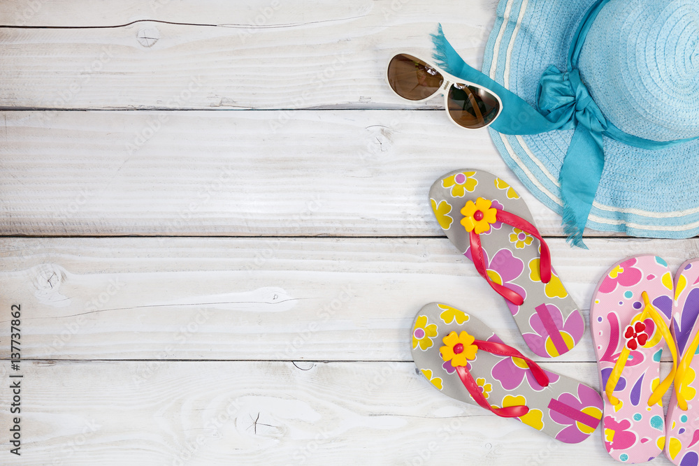 beach shoes with sunglasses and hat on white wood background,Summer holiday concept.