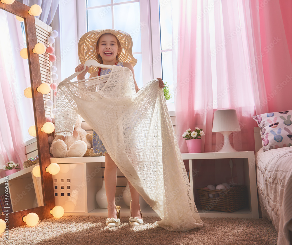 girl dresses up at home