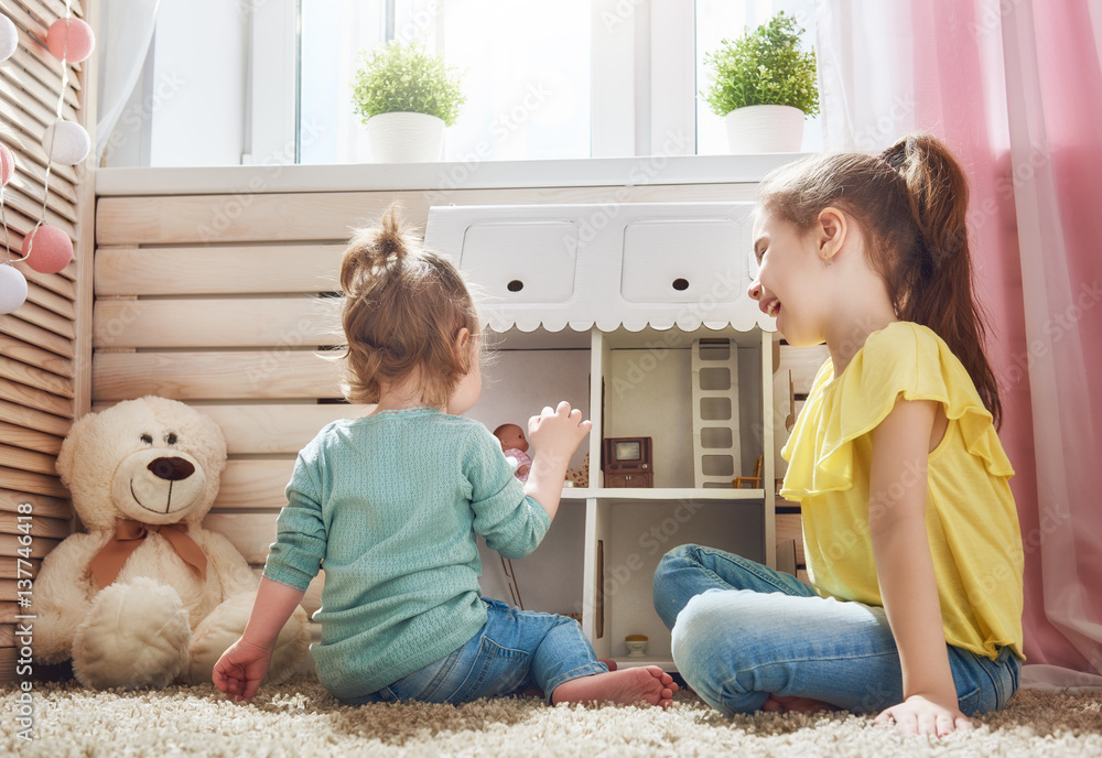 girls play with doll house