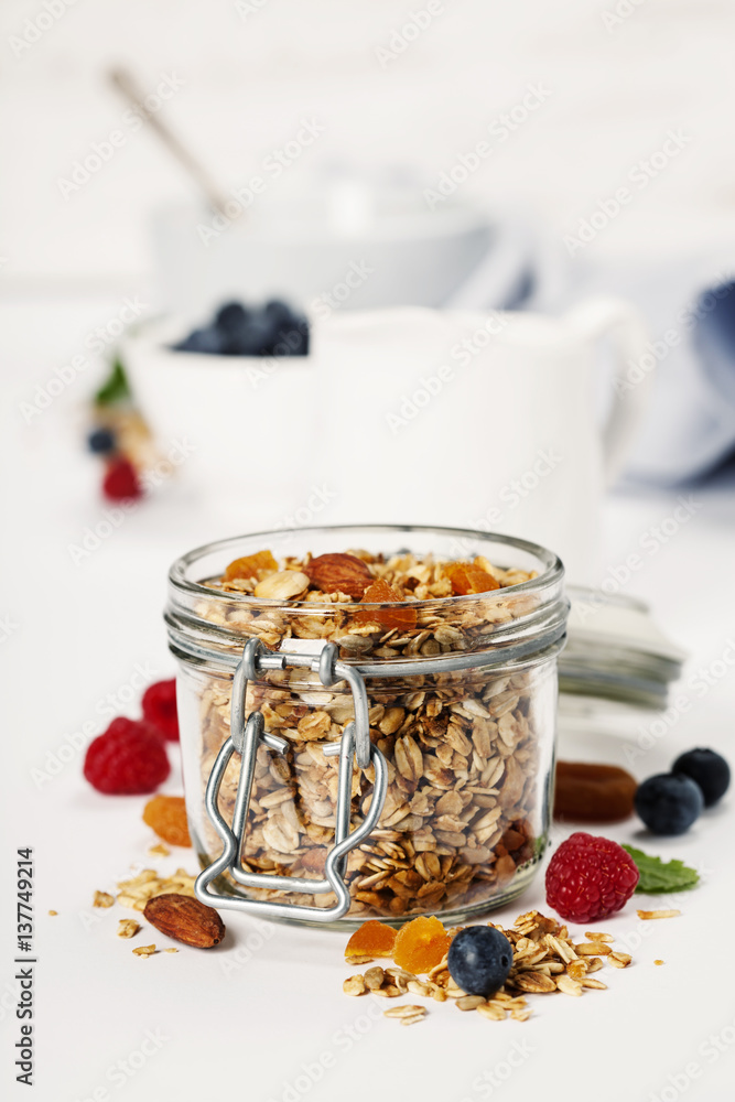 Healthy breakfast -  Homemade granola, honey, milk and berries