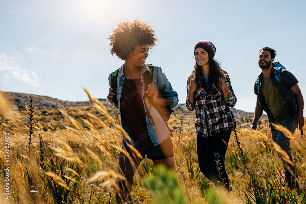 Happy group of friends hiking together