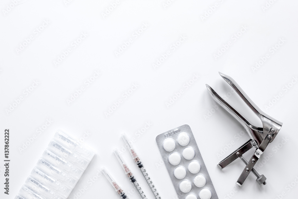 instruments of gynecologist on white background top view mock up