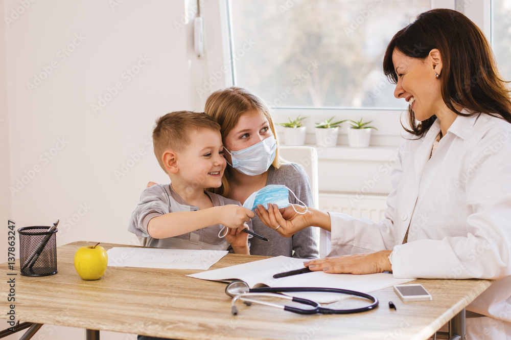 Kids having fun times at doctors. Doctor and kids playing.