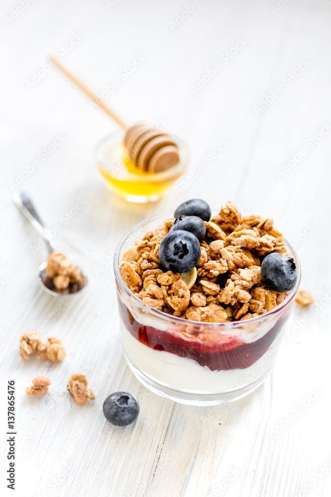 Healthy morning with granola breakfast on white kitchen table