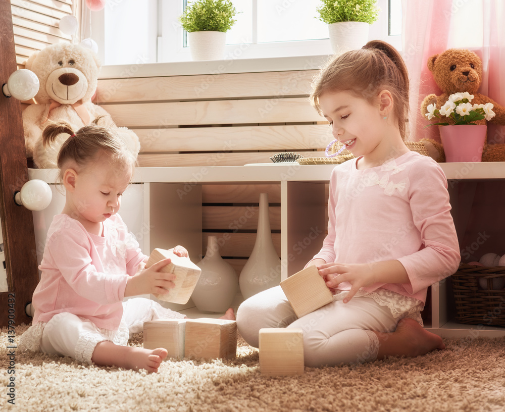 children are playing with blocks