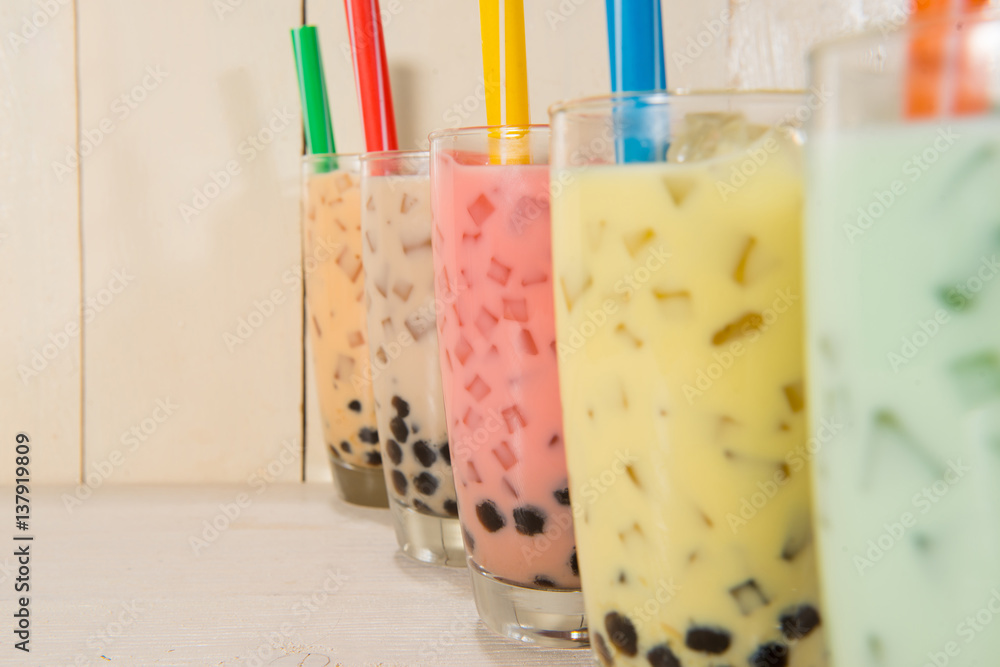 Boba / Bubble tea. Homemade Various Milk Tea with Pearls on wooden table.