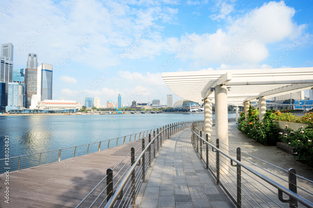 cityscape and skyline of modern city from wood footpath