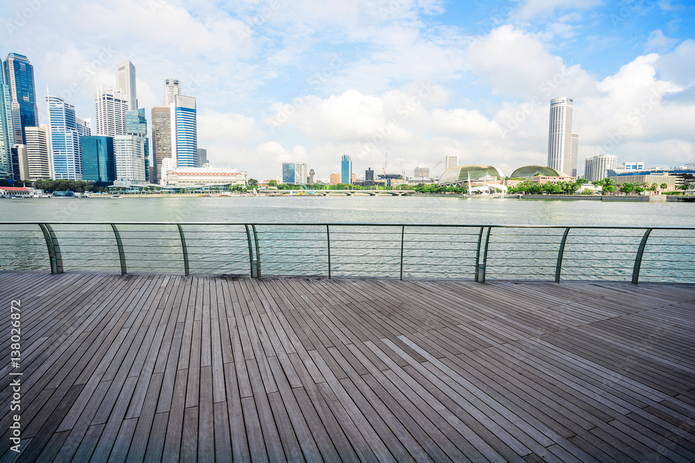 cityscape and skyline of modern city from wood footpath