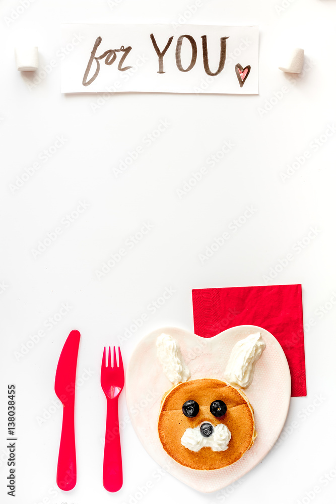 concept kid breakfast with pancake top view on white background