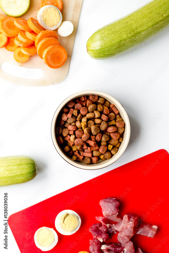 Set of animal food, meat,vegetables and eggs on kitchen top view